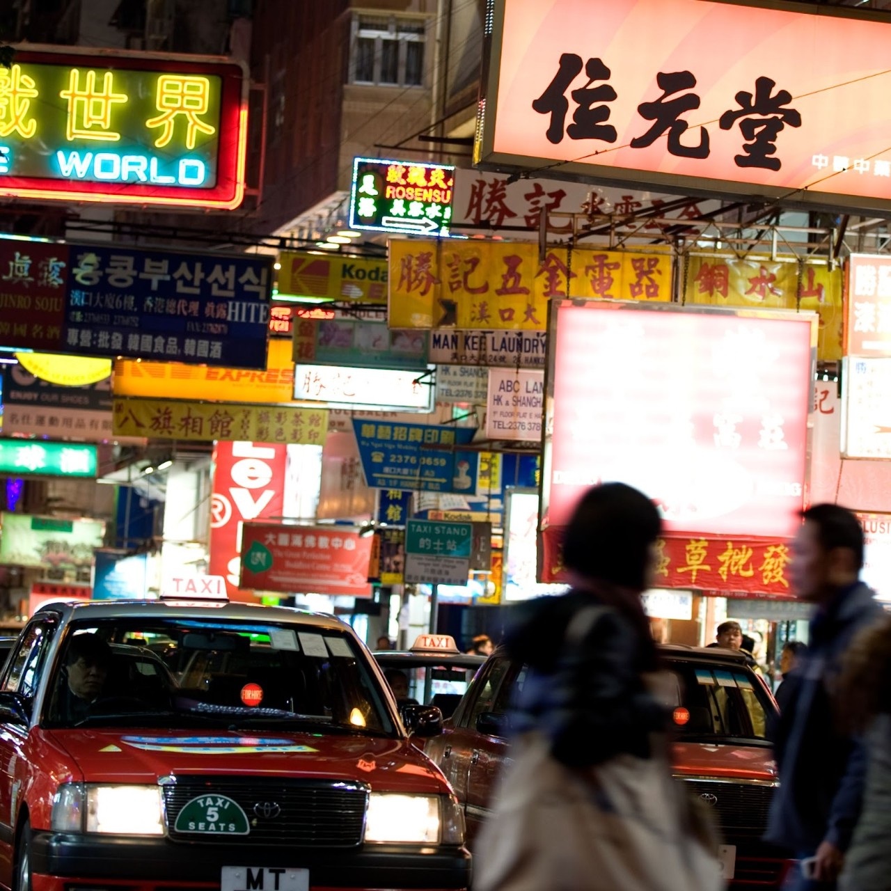 Image of people crossing the street in Hong Kong.