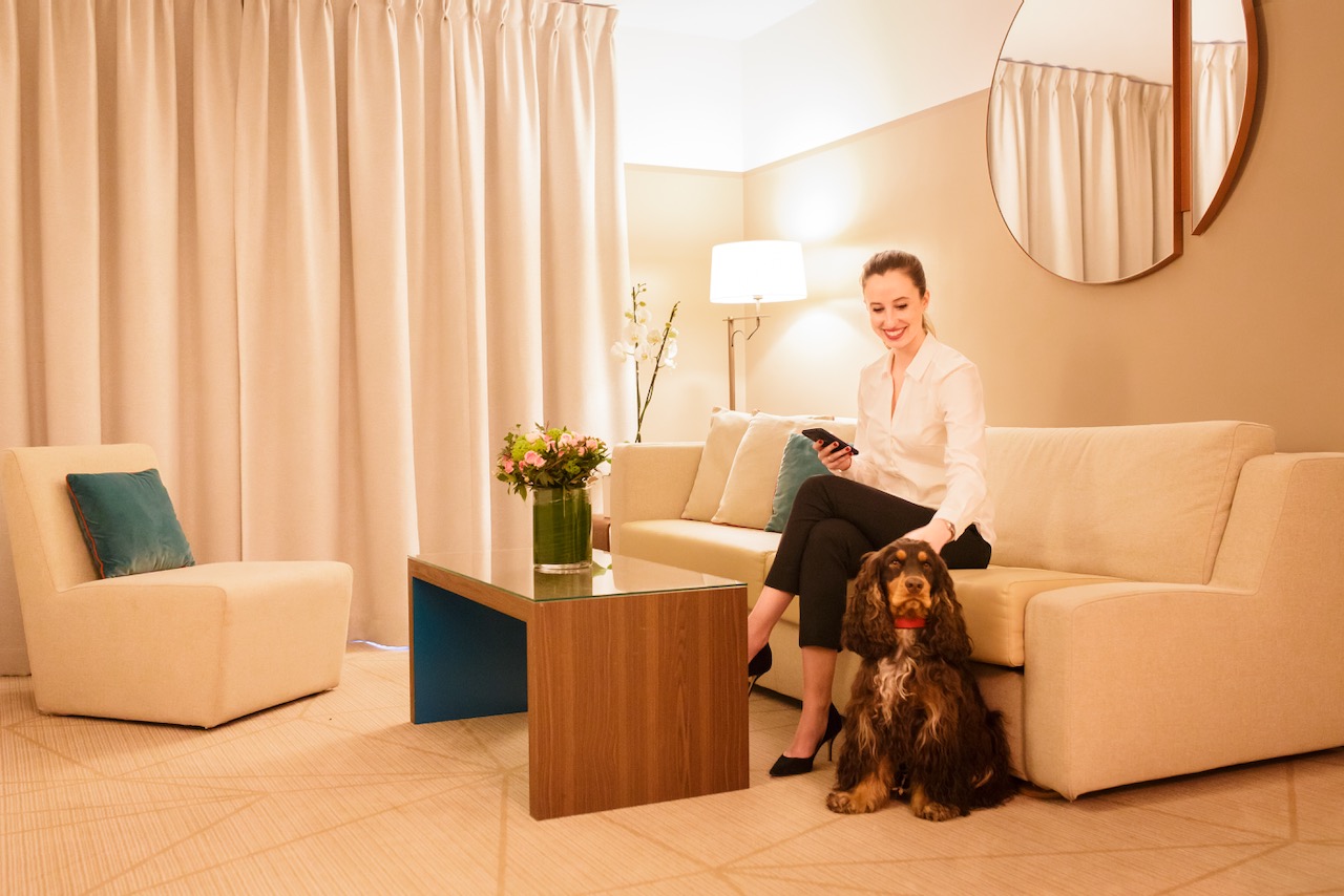 Staff welcome dog to Fraser Suites Harmonie pet friendly hotel in Paris