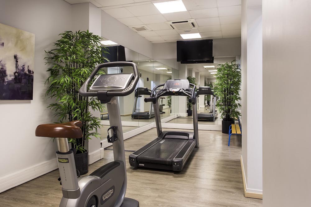 Overview of gym at Fraser Suites Harmonie hotel apartment in La Defense Paris 