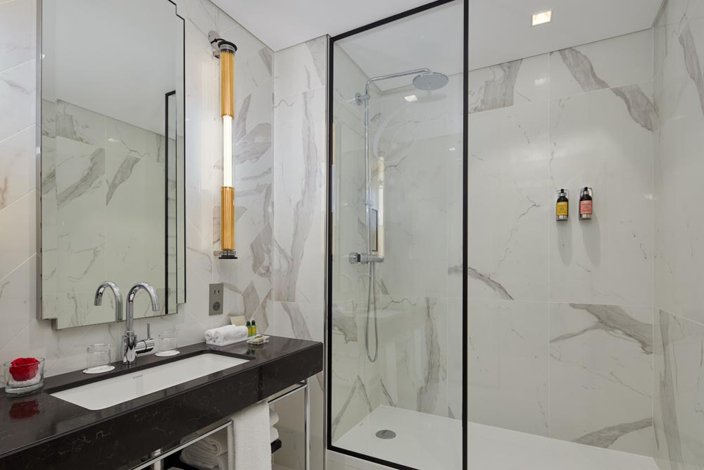 Bathroom with shower of 2 Bedroom Premier Suite, Serviced Apartment in Paris