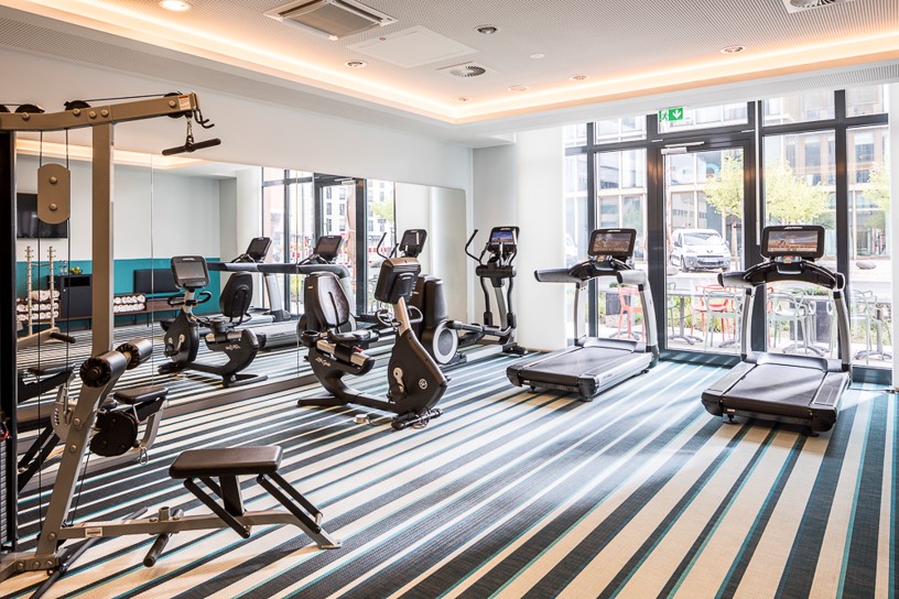 Overview of fitness room at Capri by Fraser hotel with gym in Frankfurt