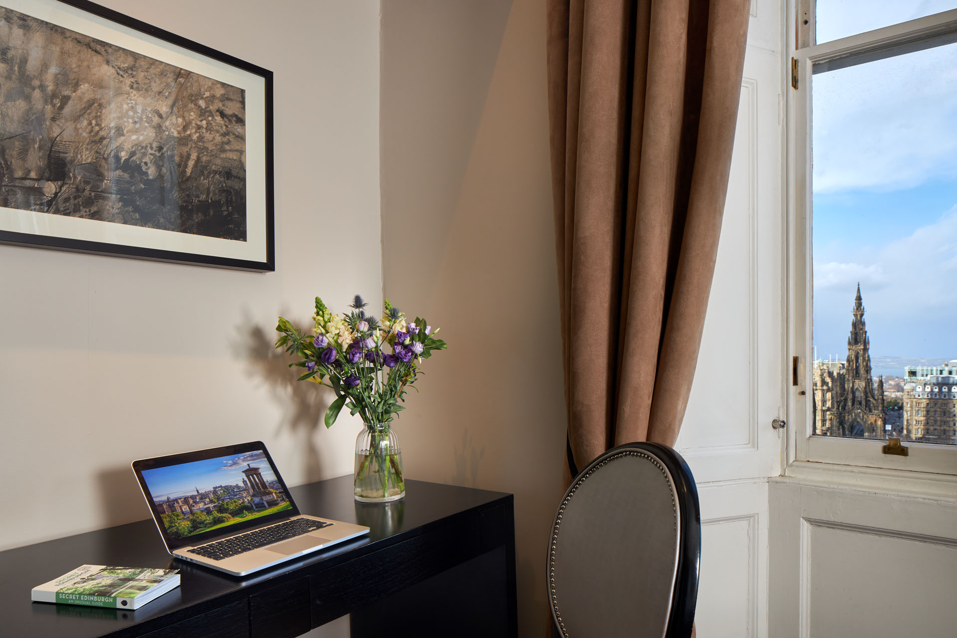 Living area of Classic Deluxe ensuite room with city view in Edinburgh