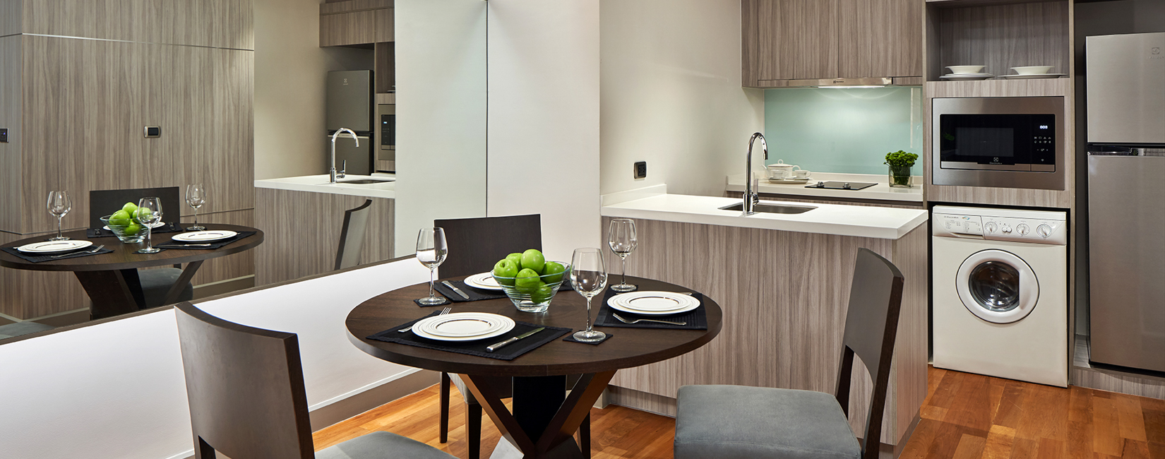 Clean and modern bathroom in Bangkok One Bedroom Premier with vanity and large mirror