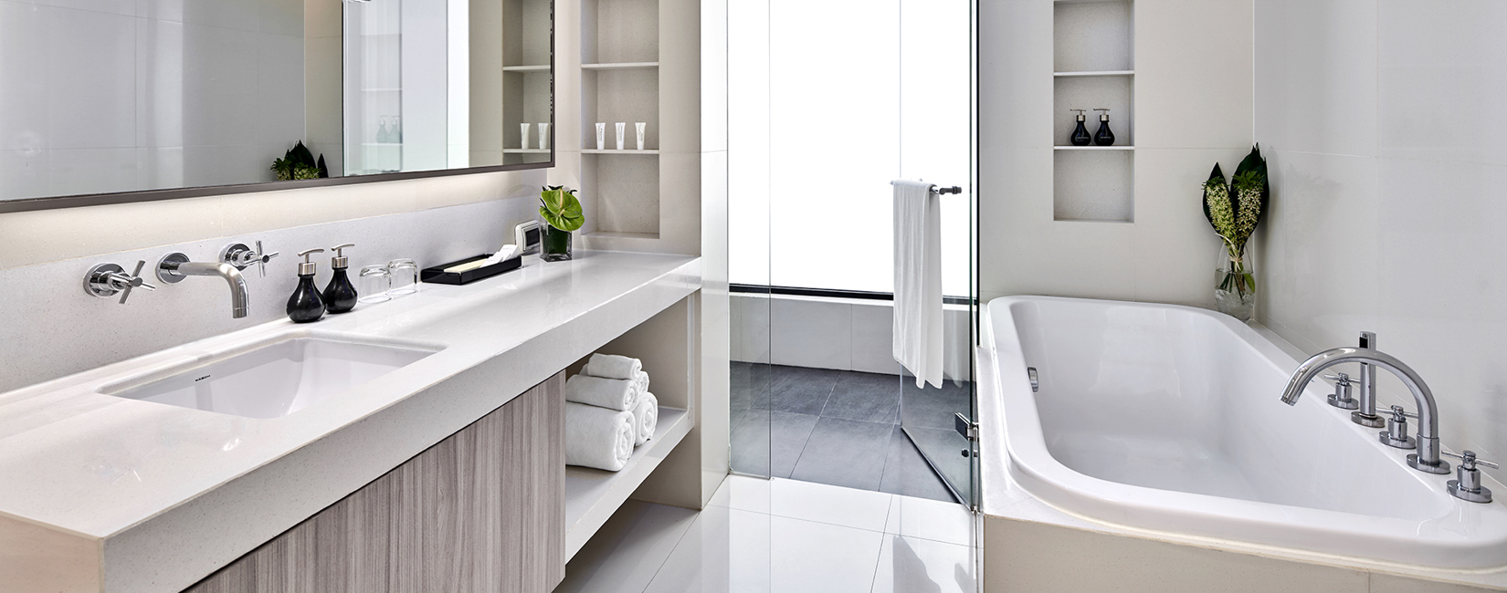 Balcony view from One-Bedroom Premier suite showcasing Bangkok skyline and natural light