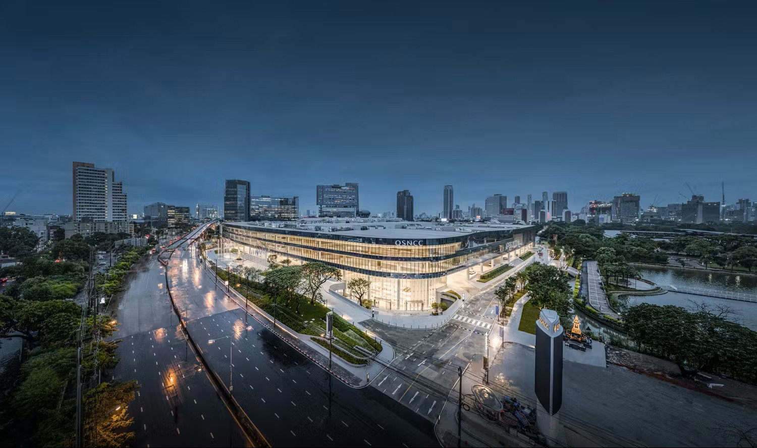 Queen Sirikit National Convention Centre (QSNCC) in Bangkok illuminated at dusk near Modena by Fraser Bangkok