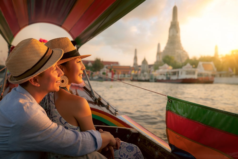 Couple enjoying a boat ride in Bangkok