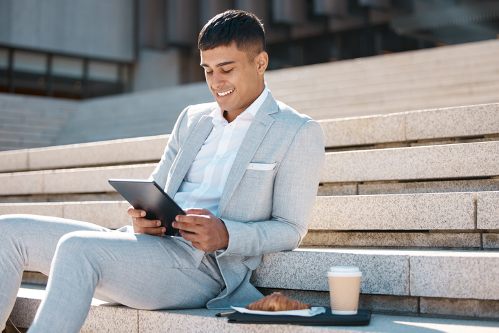 Business man enjoying breakfast in Canary Wharf