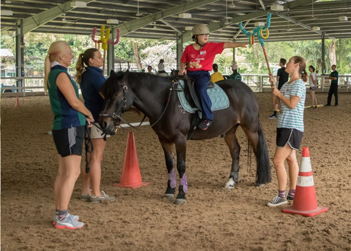 Volunteers for Riding for the Disabled (RDA) Singapore.