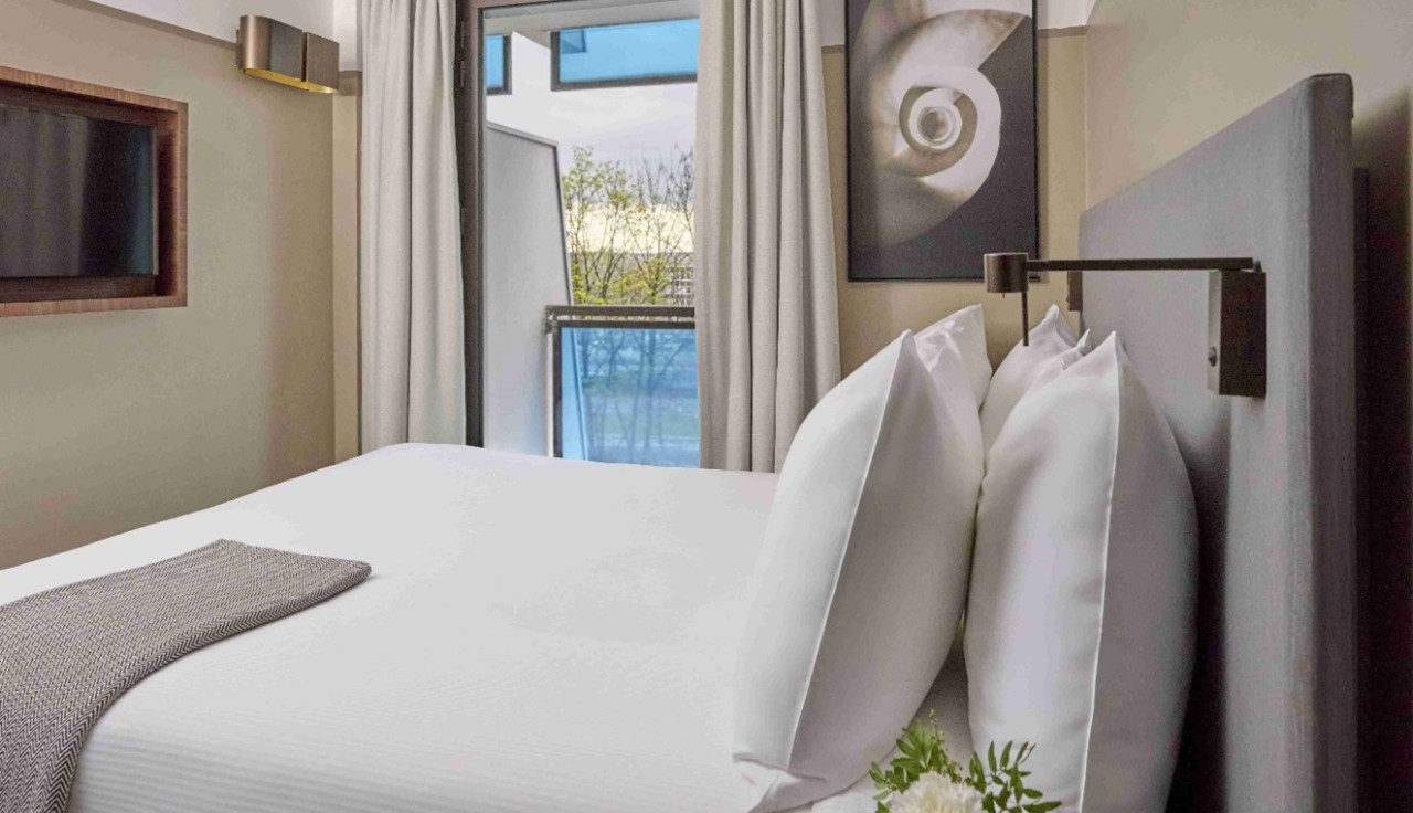 A quiet street with restaurants in the bohemian Marais district of Paris