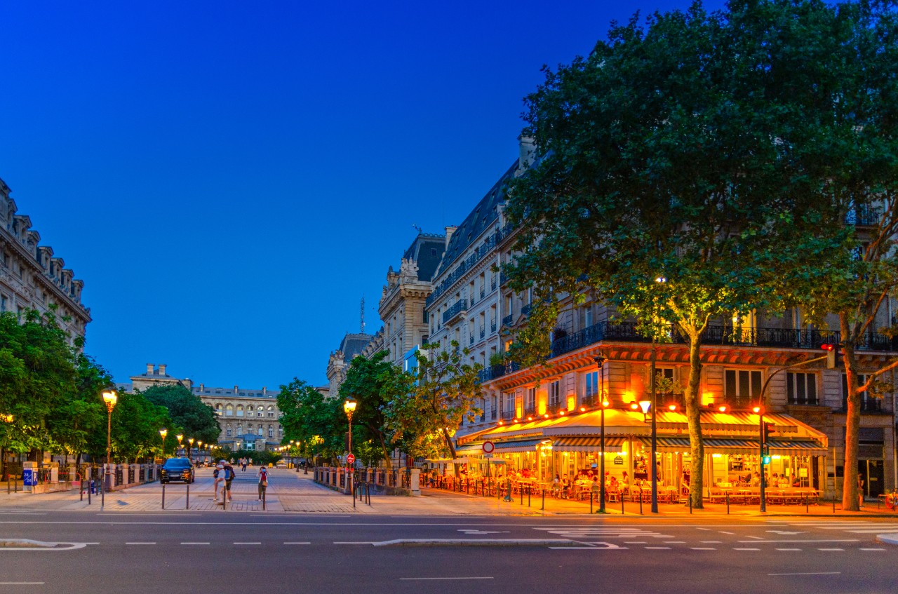 Paris city with street cafe restaurant lights in the evening