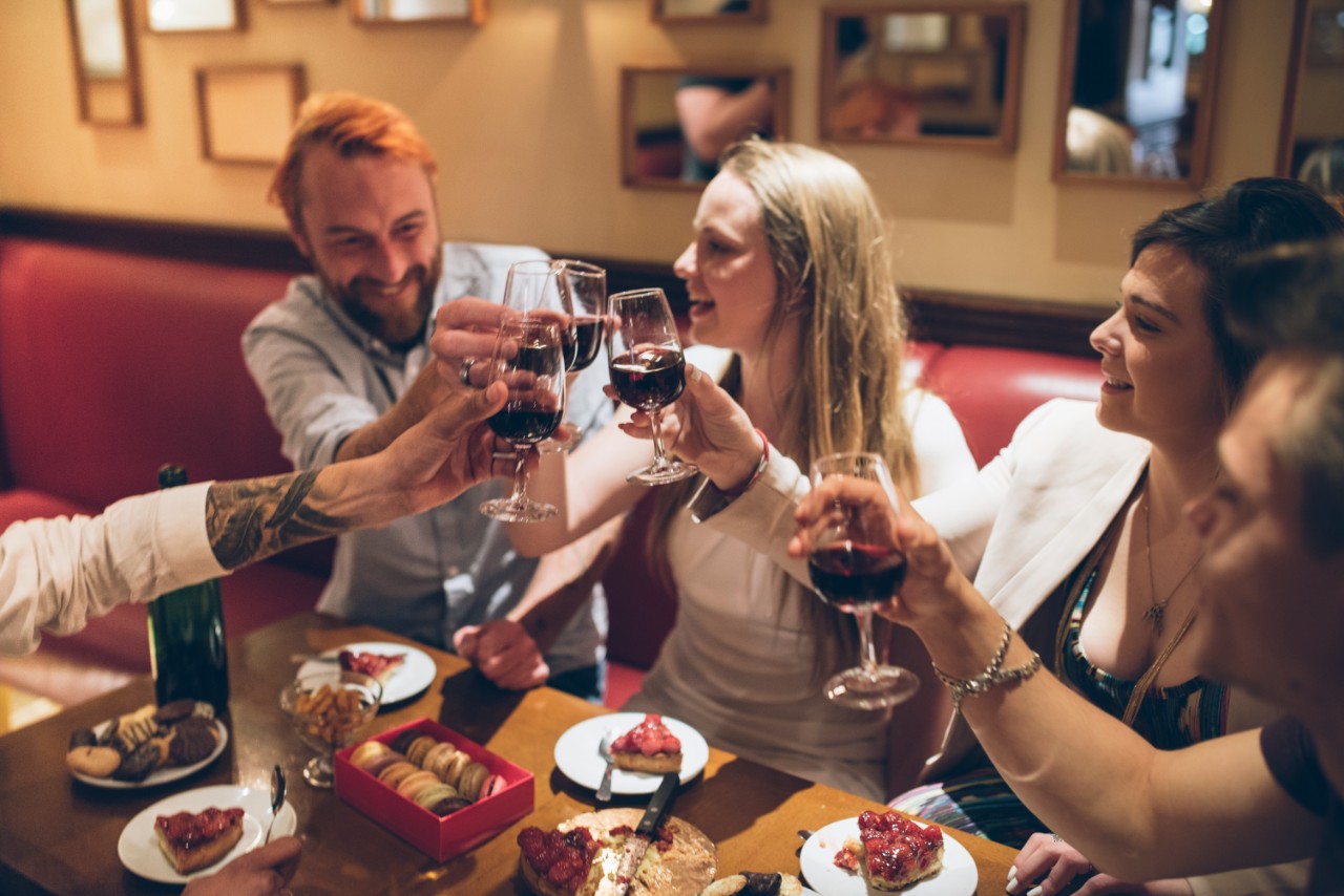 A group of friends drinking wine and having a good time