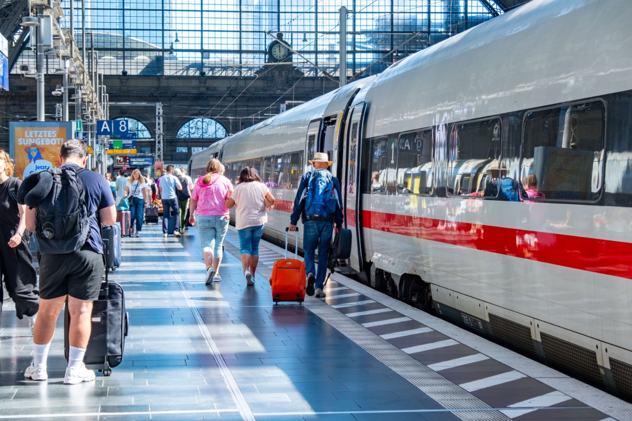 Passengers rushing to board high speed Intercity train Frankfurt central station