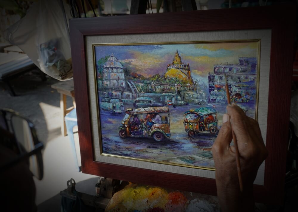 An artist painting a Bangkok-inspired scenery