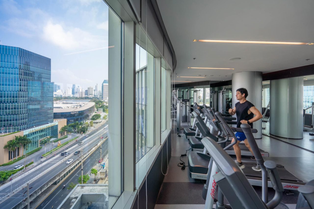 Modern gym facilities in Modena by Fraser Bangkok overlooking the city skyline