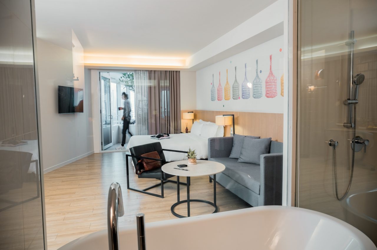 Spacious studio apartment with living area and modern furnishing at Modena by Fraser Bangkok