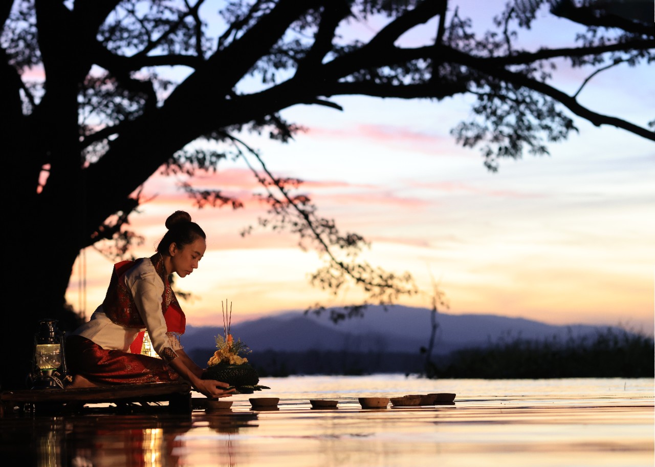 Traditional decorated krathongs on a river in Bangkok during the Loy Krathong Festival