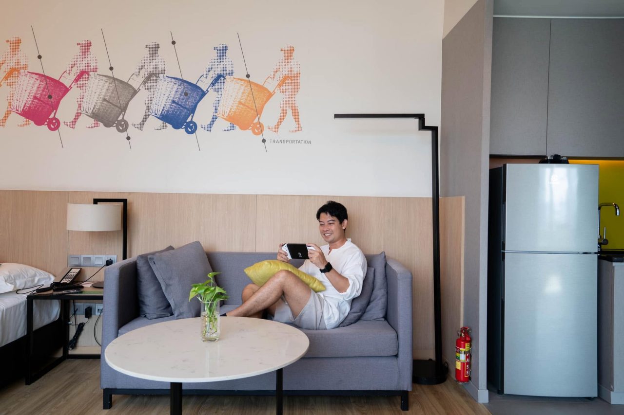 A man relaxing on a sofa.