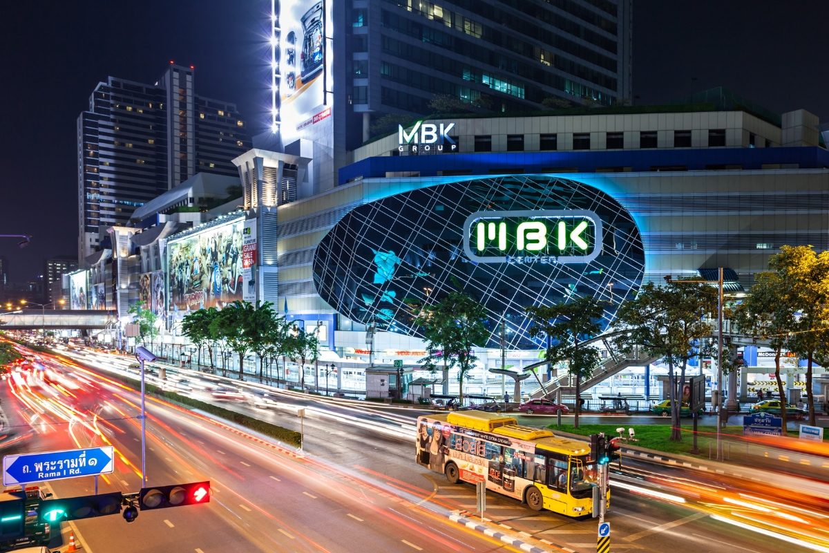 MBK Center shopping mall in Bangkok with busy streets at night