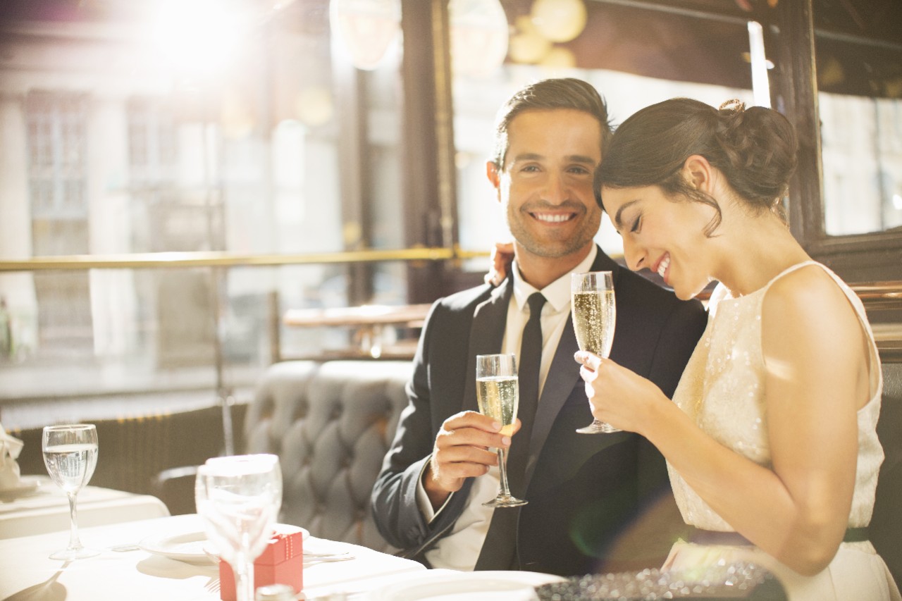 couple dressed up having a nice meal in a restaurant 
